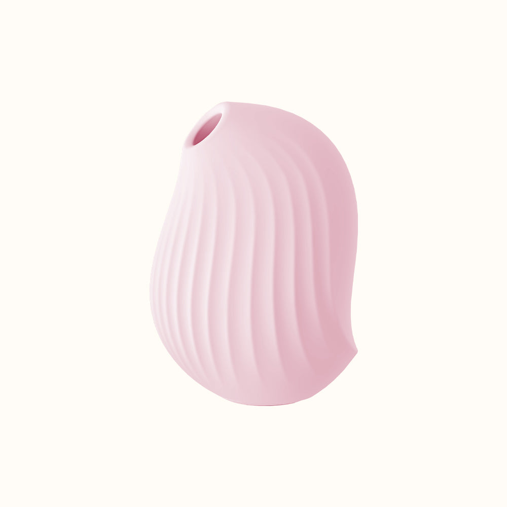 A compact, pink, ergonomic clit stimulator device designed for pleasure, with a smooth surface and body-safe silicone