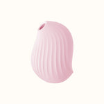 A compact, pink, ergonomic clit stimulator device designed for pleasure, with a smooth surface and body-safe silicone