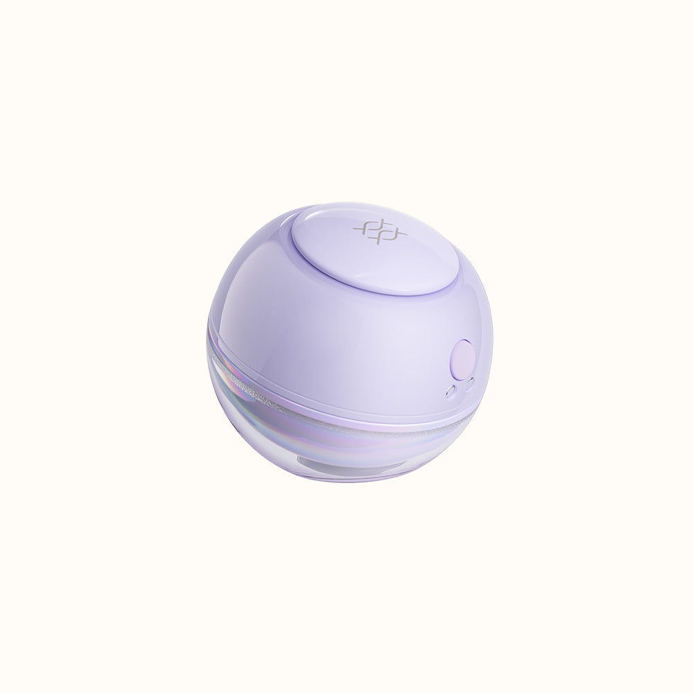 Round purple bubble clitoral stimulator device with a button on a white background