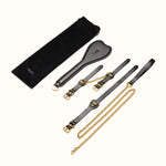 Set of Osuga fetish leather straps with gold chains and a black pouch 