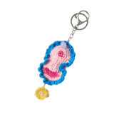 Crocheted vulva keychain with a pink and blue design
