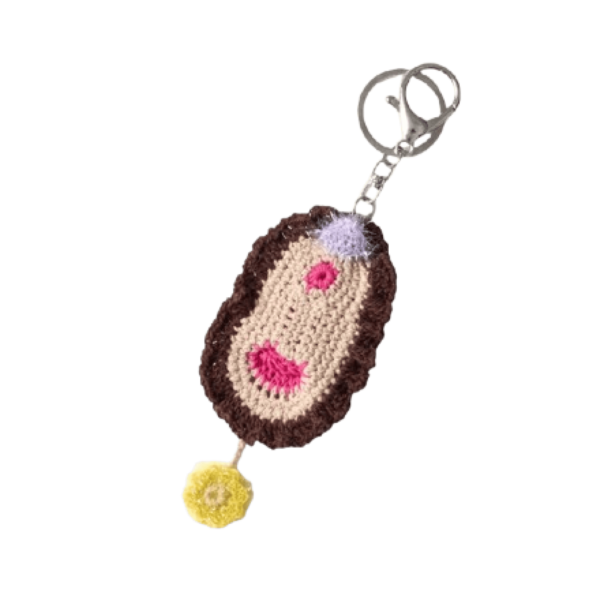 Crocheted vulva keychain with a brown base, pink hearts, and a yellow flower